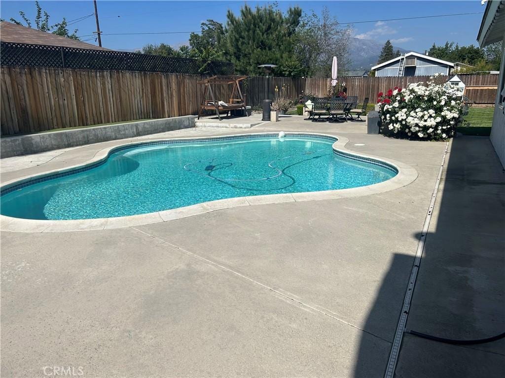 12630 Maple Ct, Yucaipa, CA 92399 - view of pool with a patio area and a fenced backyard