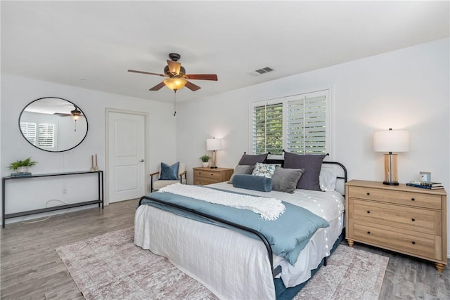 bedroom with wood finished floors and ceiling fan