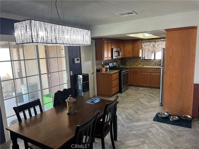 5888 Clare Ave Unit 29, Palms, CA 92277 - dining room with crown molding