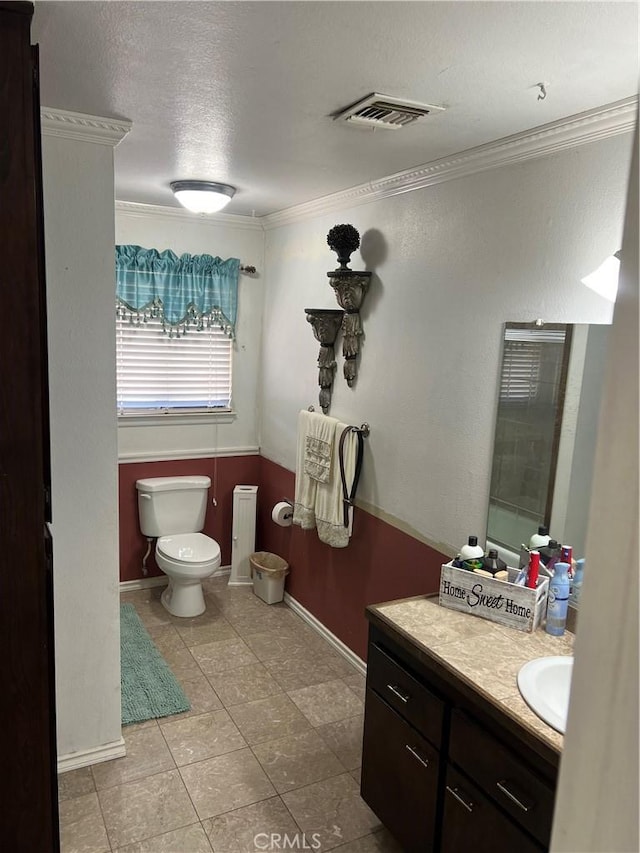 5888 Clare Ave Unit 29, Palms, CA 92277 - bathroom featuring ornamental molding, toilet, vanity, tile patterned floors, and baseboards