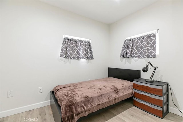 1411 Coolidge Ave, Pasadena, CA 91104 - bedroom featuring wood finished floors and baseboards