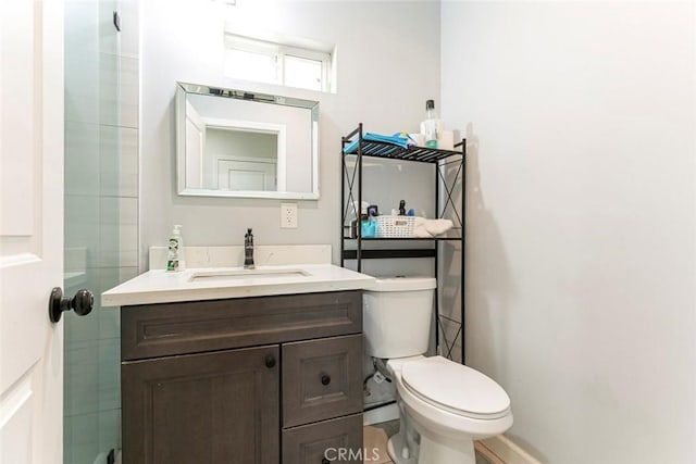 1411 Coolidge Ave, Pasadena, CA 91104 - bathroom featuring vanity, toilet, and baseboards