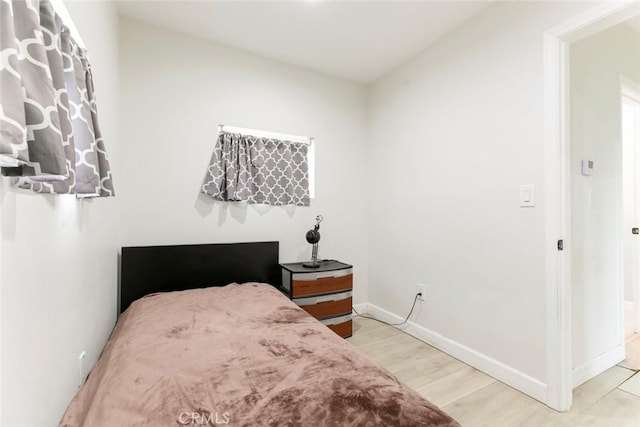 1411 Coolidge Ave, Pasadena, CA 91104 - bedroom featuring baseboards and wood finished floors