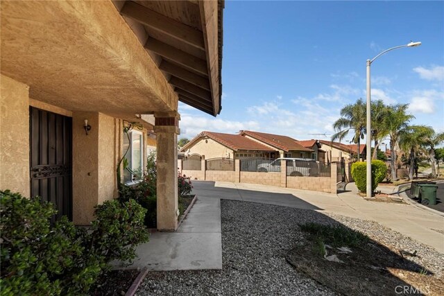 14881 Hawthorne Ave, Fontana, CA 92335 - view of yard featuring fence and a residential view