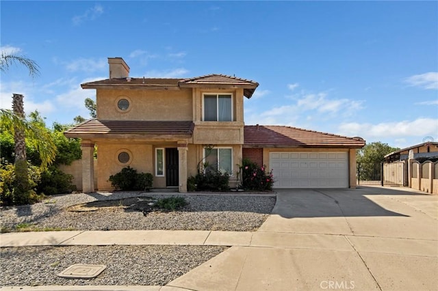 14881 Hawthorne Ave, Fontana, CA 92335 - view of front of property featuring concrete driveway, an attached garage, stucco siding, a gate, and fence