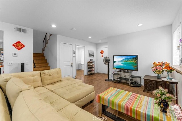 14881 Hawthorne Ave, Fontana, CA 92335 - living area with stairs, wood finished floors, and recessed lighting