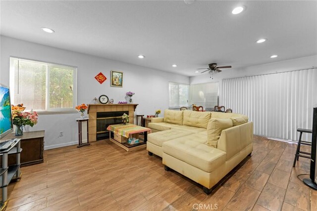 14881 Hawthorne Ave, Fontana, CA 92335 - living room featuring light wood-type flooring, recessed lighting, a ceiling fan, and baseboards