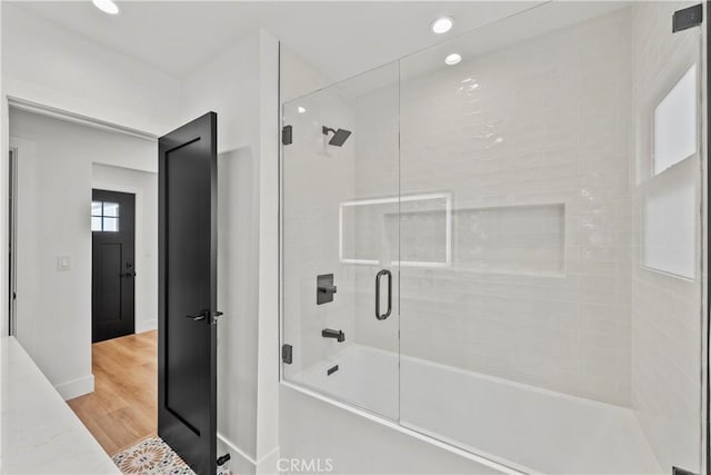 7307 Forbes Ave, Lake Balboa, CA 91406 - full bathroom with enclosed tub / shower combo, wood finished floors, recessed lighting, and baseboards