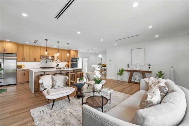 7307 Forbes Ave, Lake Balboa, CA 91406 - living room featuring recessed lighting, light wood-type flooring, and baseboards