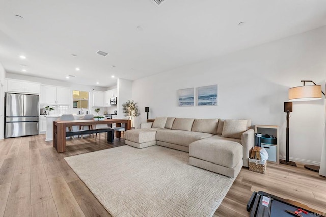 1646 Fig Tree Way, Oceanside, CA 92056 - living area with light wood-style flooring and recessed lighting