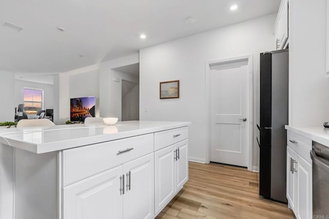 1646 Fig Tree Way, Oceanside, CA 92056 - kitchen featuring appliances with stainless steel finishes, white cabinetry, light wood finished floors, light countertops, and recessed lighting