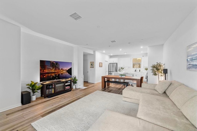 1646 Fig Tree Way, Oceanside, CA 92056 - living room with light wood-style floors, recessed lighting, and baseboards