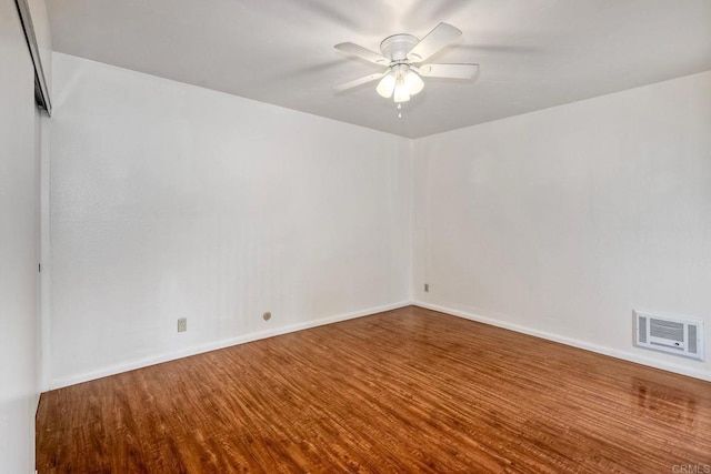 1307 Caminito Gabaldon Unit B, San Diego, CA 92108 - spare room featuring wood finished floors, a ceiling fan, and baseboards