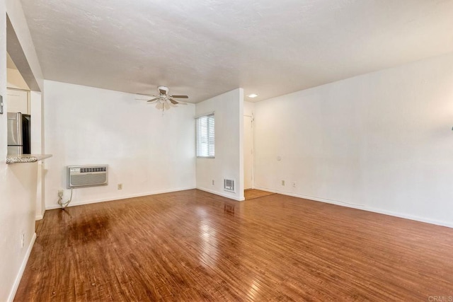 1307 Caminito Gabaldon Unit B, San Diego, CA 92108 - empty room with wood finished floors, an AC wall unit, ceiling fan, and baseboards