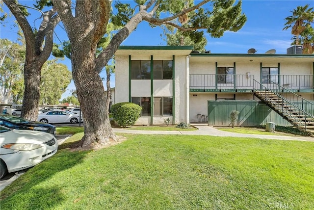 1735 E Washington St Unit B28, Colton, CA 92324 - view of building exterior with stairs and cooling unit