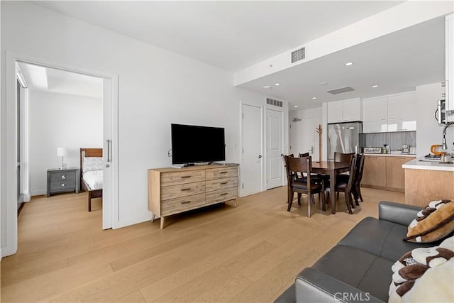 400 S Broadway Unit 2004, Los Angeles, CA 90013 - living room with light wood-style flooring and recessed lighting