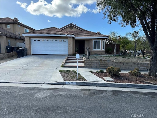 532 Hayes Cir, Corona, CA 92879 - ranch-style house with a garage, driveway, stucco siding, and a tiled roof