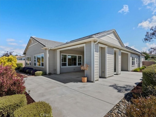 920 Trail View Pl, Nipomo, CA 93444 - rear view of house featuring a patio, an attached garage, and driveway