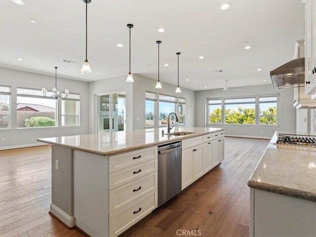 920 Trail View Pl, Nipomo, CA 93444 - kitchen with stainless steel appliances, a sink, exhaust hood, hardwood / wood-style flooring, and recessed lighting
