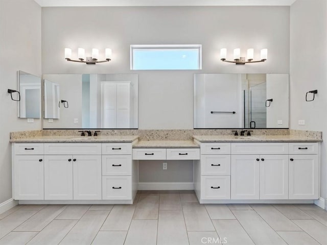 920 Trail View Pl, Nipomo, CA 93444 - bathroom with a shower stall, two vanities, and baseboards