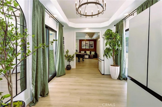 20139 Lake Canyon Dr, Walnut, CA 91789 - corridor featuring a chandelier, light wood finished floors, and a raised ceiling