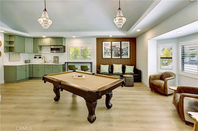 20139 Lake Canyon Dr, Walnut, CA 91789 - game room with a chandelier, a sink, a tray ceiling, recessed lighting, and light wood-type flooring