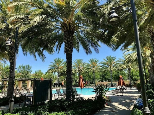 community pool featuring a patio area