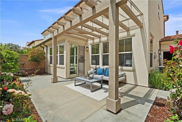 view of patio featuring a pergola, an outdoor living space, and fence