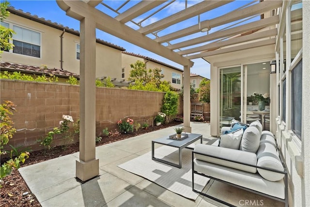 view of patio / terrace with fence, a pergola, and an outdoor hangout area
