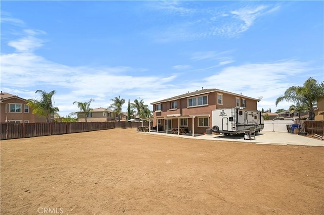 19883 San Juan Capistrano Ct, Riverside, CA 92508 - back of property featuring a patio and a fenced backyard