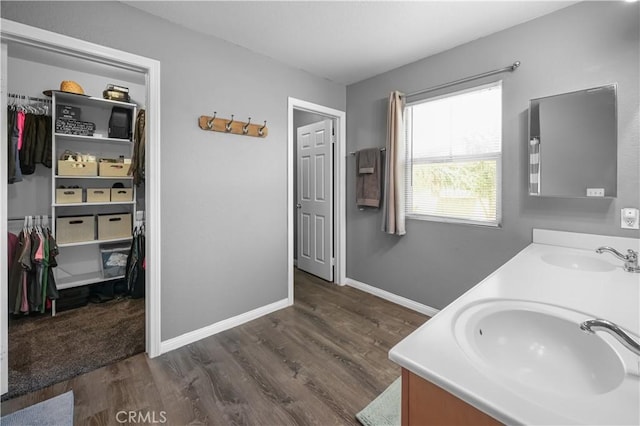 19883 San Juan Capistrano Ct, Riverside, CA 92508 - full bathroom featuring double vanity, wood finished floors, and a spacious closet