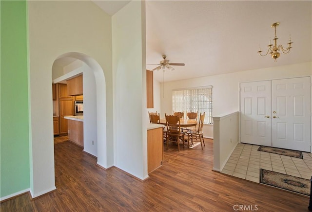 35823 48th St E, Palmdale, CA 93552 - foyer entrance featuring wood finished floors, a ceiling fan, baseboards, and arched walkways