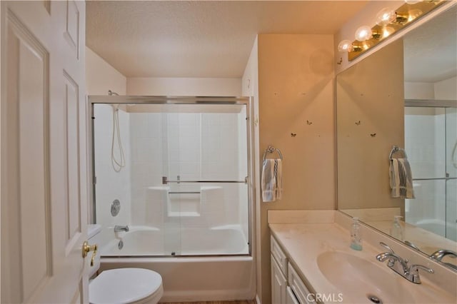 35823 48th St E, Palmdale, CA 93552 - bathroom featuring toilet, a textured ceiling, vanity, and enclosed tub / shower combo