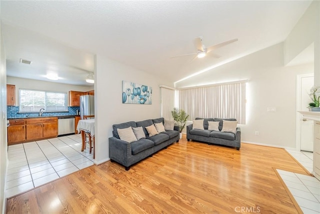3628 Grizzley Creek Ct, Ontario, CA 91761 - living area featuring ceiling fan, light wood-type flooring, and lofted ceiling