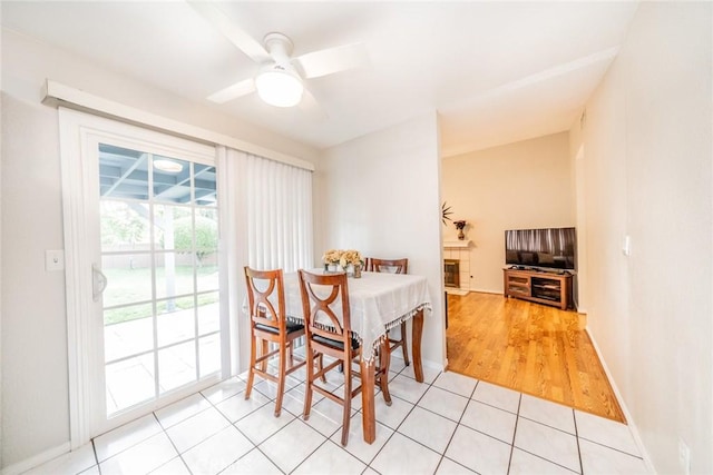 3628 Grizzley Creek Ct, Ontario, CA 91761 - dining area with a ceiling fan, light tile patterned flooring, and baseboards