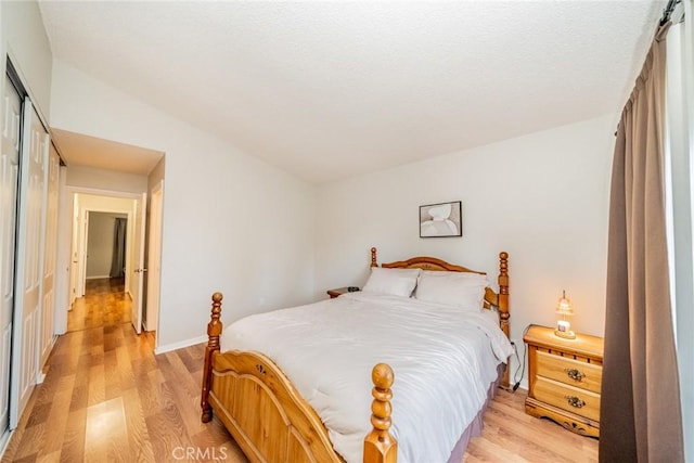 3628 Grizzley Creek Ct, Ontario, CA 91761 - bedroom featuring light wood-style floors, a closet, and baseboards