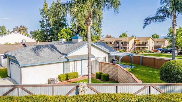 3628 Grizzley Creek Ct, Ontario, CA 91761 - view of side of property featuring stucco siding, roof with shingles, and a residential view