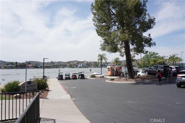 23618 Canyon Lake Dr N, Canyon Lake, CA 92587 - view of asphalt street featuring a water view and street lights