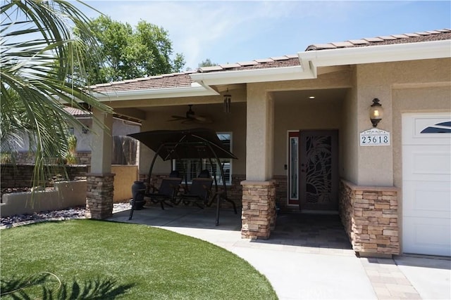 23618 Canyon Lake Dr N, Canyon Lake, CA 92587 - entrance to property featuring stucco siding, a ceiling fan, stone siding, and a patio