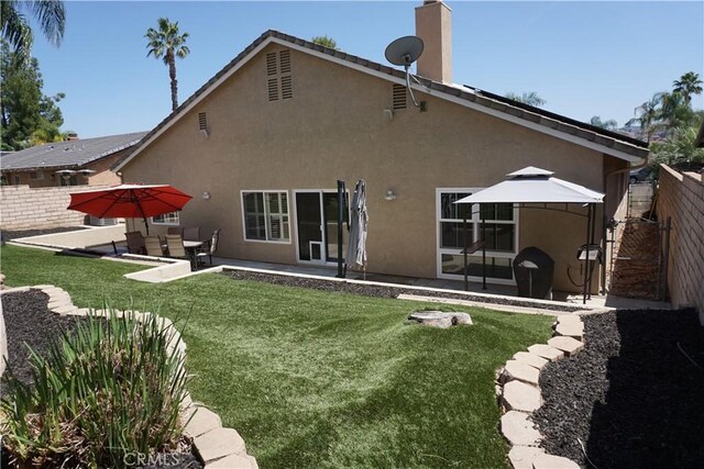 23618 Canyon Lake Dr N, Canyon Lake, CA 92587 - back of house featuring a patio, stucco siding, and a chimney