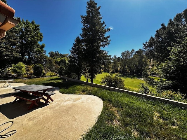 19628 Pine Valley Ave, Porter Ranch, CA 91326 - view of patio / terrace with outdoor dining space and view of scattered trees