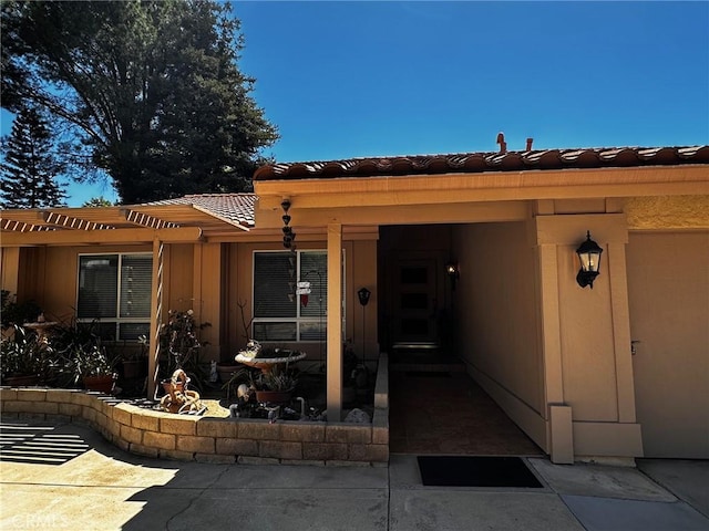 19628 Pine Valley Ave, Porter Ranch, CA 91326 - property entrance with a tiled roof