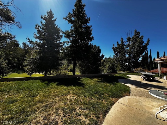 19628 Pine Valley Ave, Porter Ranch, CA 91326 - view of green lawn featuring a patio area