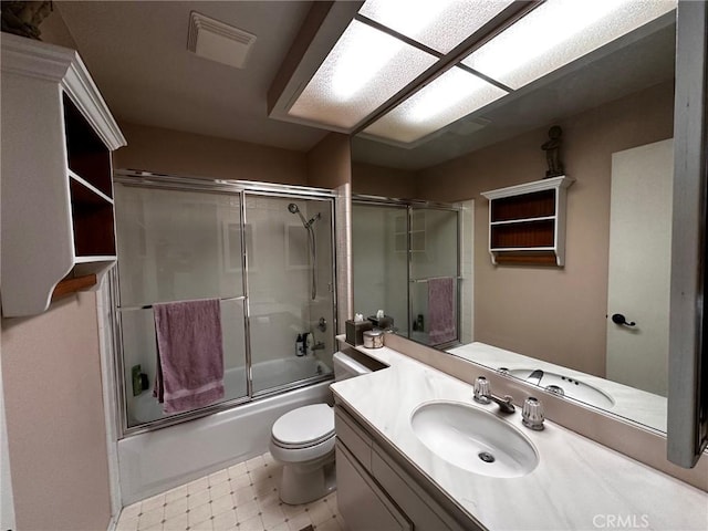19628 Pine Valley Ave, Porter Ranch, CA 91326 - full bathroom with tile patterned floors, shower / bath combination with glass door, toilet, and vanity