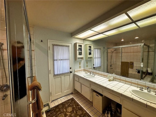 19628 Pine Valley Ave, Porter Ranch, CA 91326 - bathroom with a stall shower, tile patterned floors, and double vanity