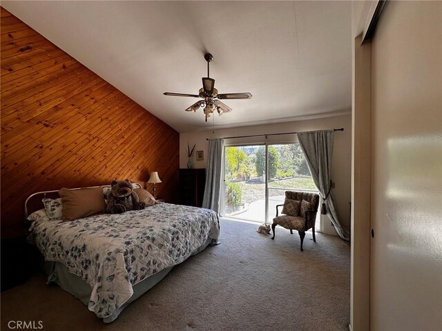 19628 Pine Valley Ave, Porter Ranch, CA 91326 - bedroom with access to exterior, wooden walls, carpet flooring, and a ceiling fan