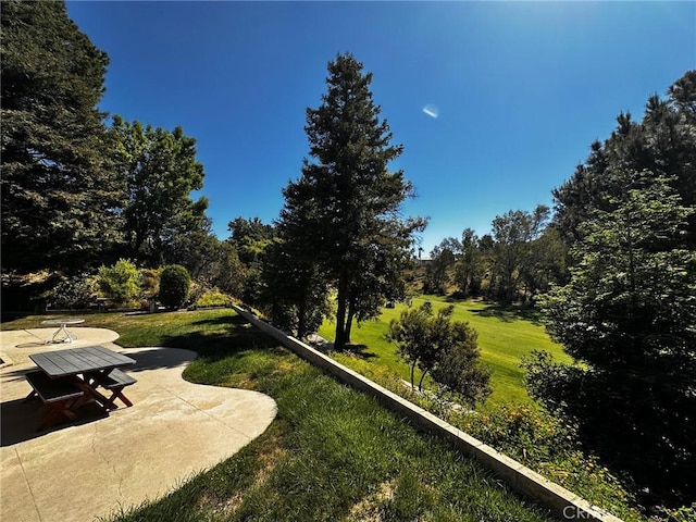 19628 Pine Valley Ave, Porter Ranch, CA 91326 - view of grassy yard featuring a patio area
