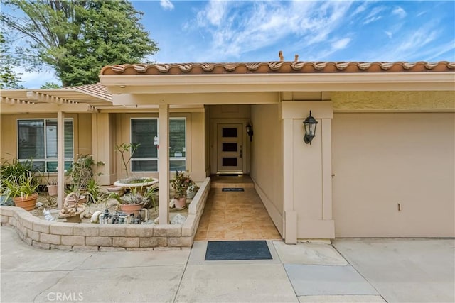 19628 Pine Valley Ave, Porter Ranch, CA 91326 - property entrance featuring a tiled roof and a pergola