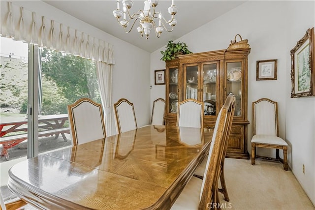 19628 Pine Valley Ave, Porter Ranch, CA 91326 - dining area featuring lofted ceiling, a chandelier, and light carpet