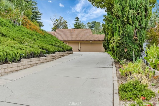 19628 Pine Valley Ave, Porter Ranch, CA 91326 - view of front of home featuring a garage, concrete driveway, and a tile roof